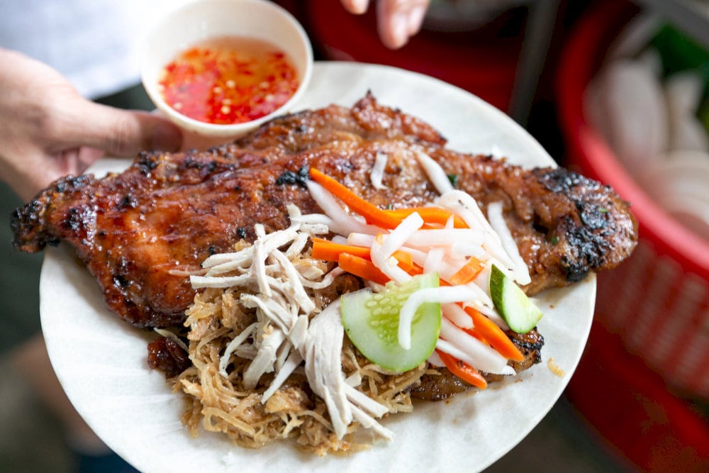 Tender grilled pork, shredded pork skin topped with fish sauce and pickles is comfort food